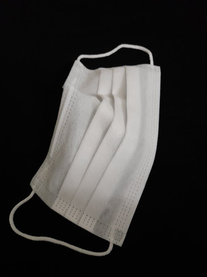 White Mask on Black Background Stock Photo - Image of background, covid