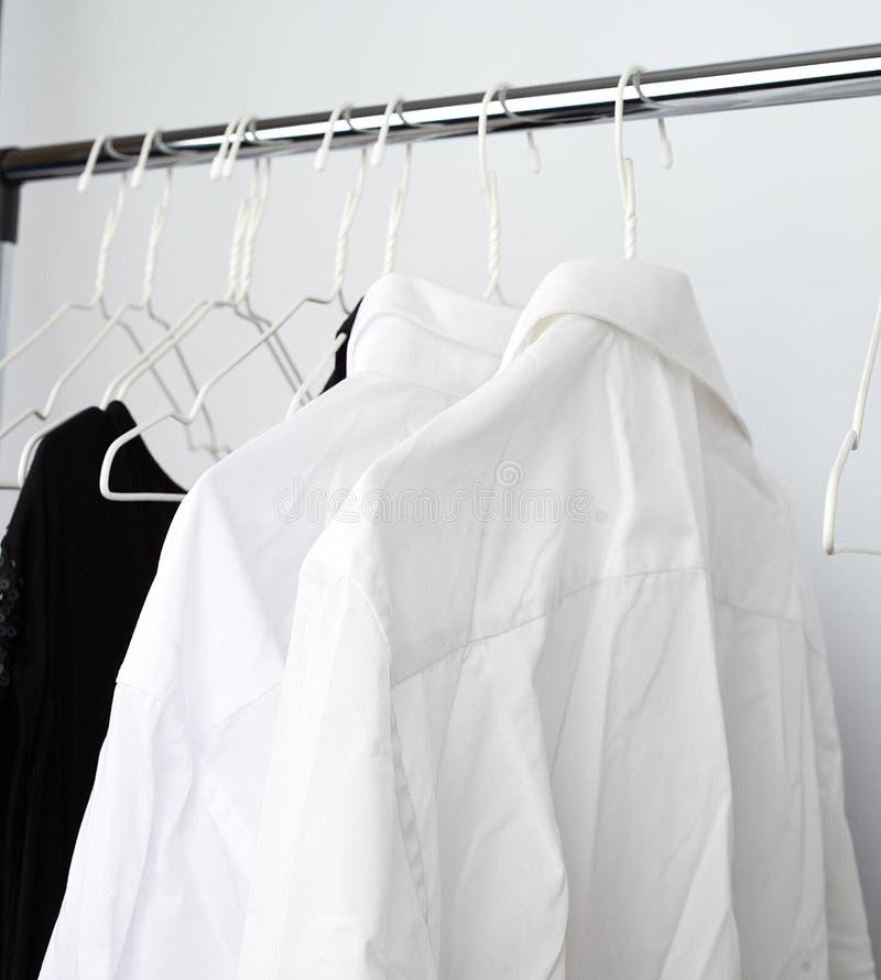 White Men S Crumpled Shirts Hanging on a Metal Hanger Stock Image ...