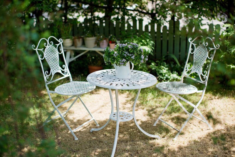 White metal garden table and chairs