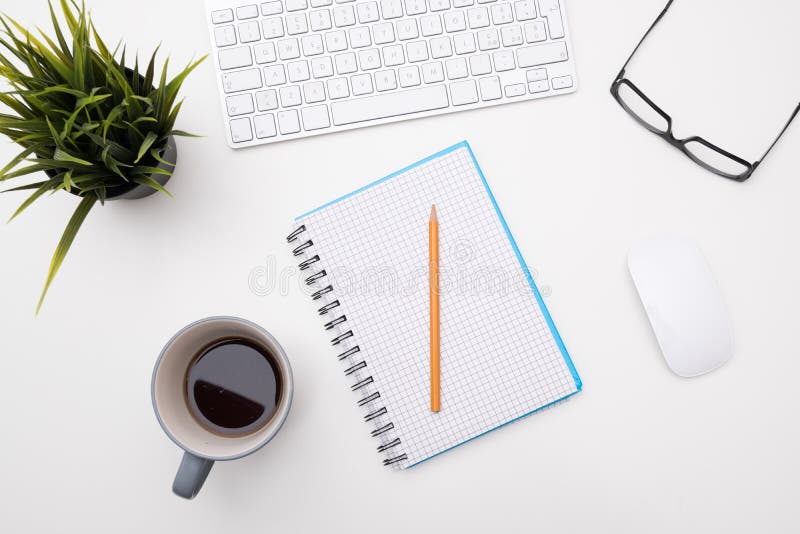 White minimal desk office with cup of coffee stock images