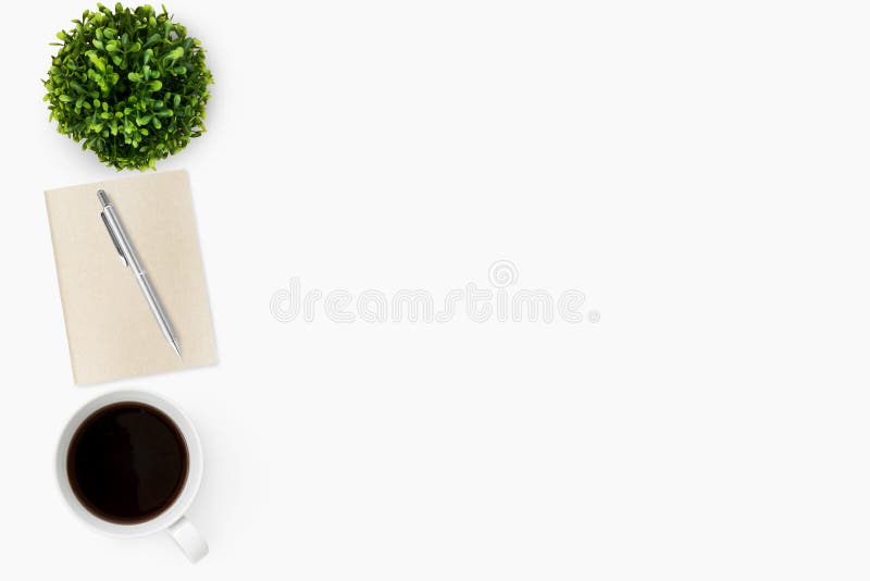 White minimal office desk table with notebook, pen and cup of coffee. Top view with copy space, flat lay royalty free stock photo