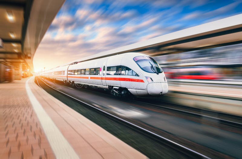White modern high speed train in motion