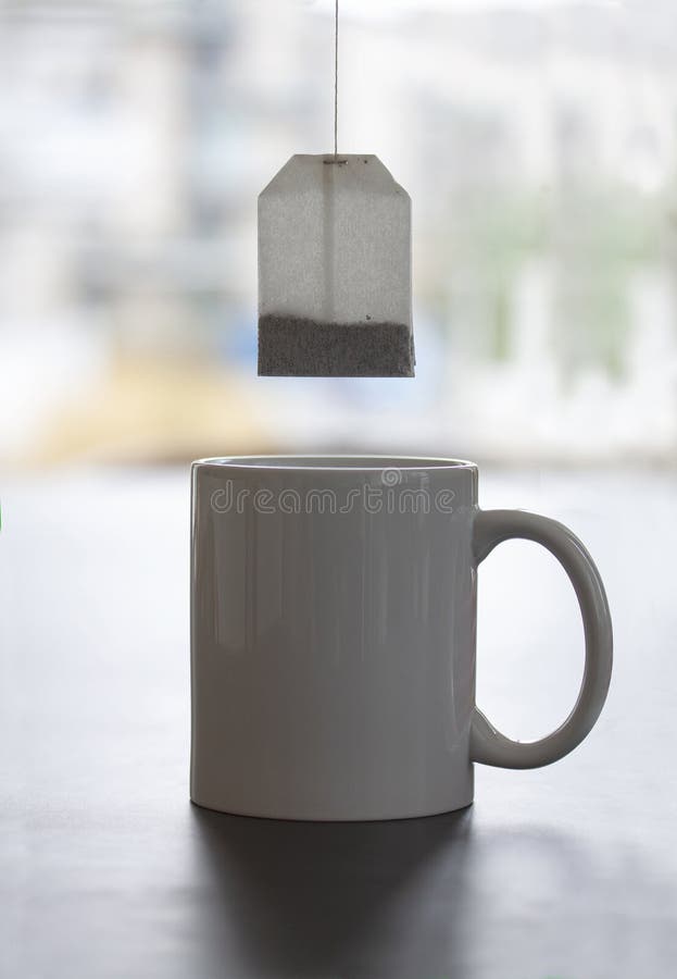 White Mug Stands on a Table with Tea Bag Hanging Stock Image Image of