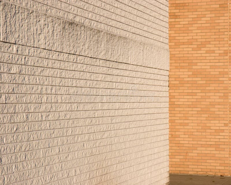 White and natural brick walls meeting