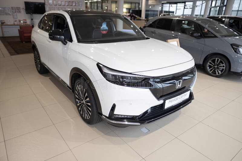 White new Honda e:Ny1 Electric Car, Japanese transnational corporation Honda Motor in showroom, sustainable development EV, Innovation automotive industry show in Wiesbaden, Germany - January 25, 2024. Development ev stock images, royalty-free photos and pictures