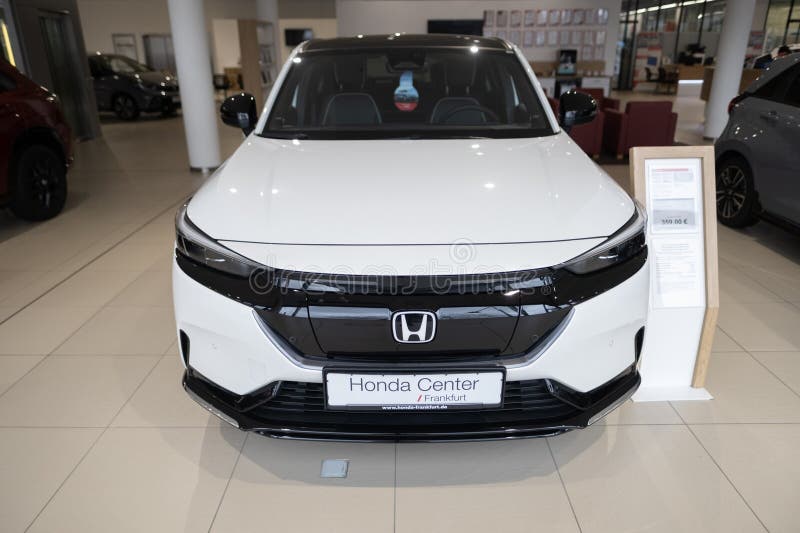 White new Honda e:Ny1 Electric Car, Japanese transnational corporation Honda Motor in showroom, sustainable development EV, Innovation automotive industry show in Wiesbaden, Germany - January 25, 2024. Development ev stock images, royalty-free photos and pictures