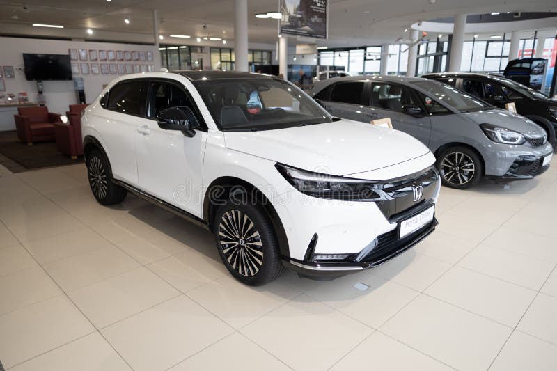 White new Honda e:Ny1 Electric Car, Japanese transnational corporation Honda Motor in showroom, sustainable development EV, Innovation automotive industry show in Wiesbaden, Germany - January 25, 2024. Development ev stock images, royalty-free photos and pictures