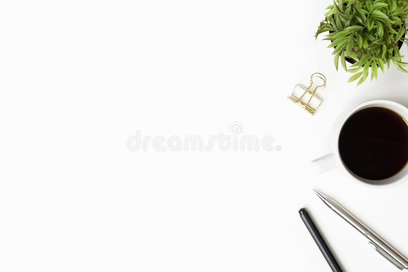 White office desk table with cup of coffee, pen and supplies. Top view with copy space, flat lay royalty free stock images