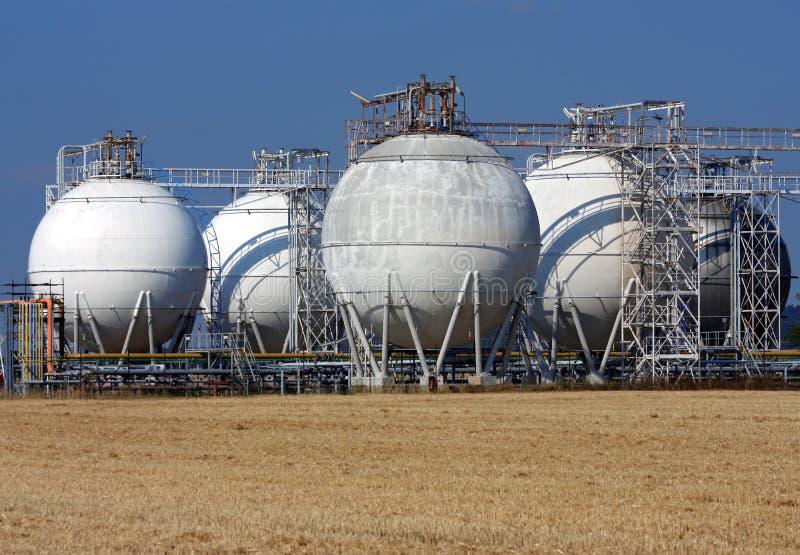 White Tanks of Big Crude Oil Refinery Stock Photo Image of