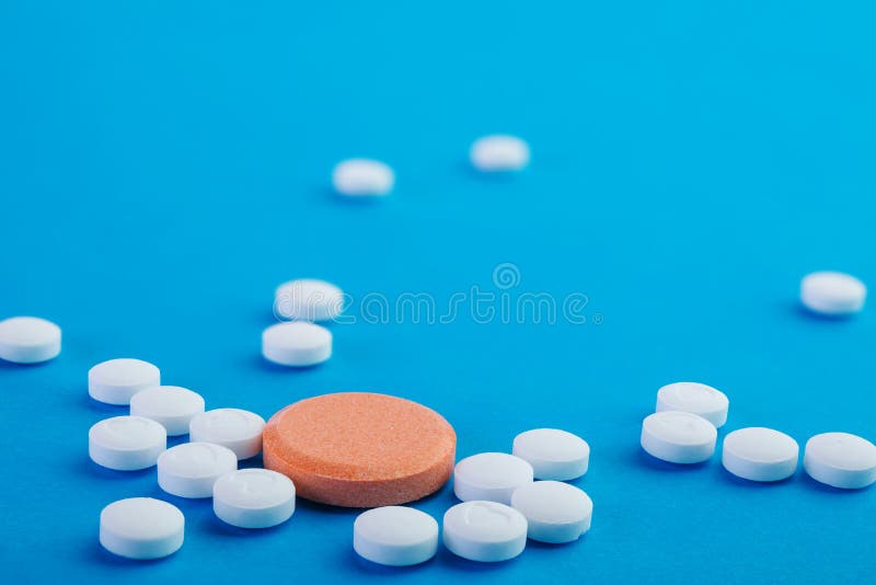 White and orange pills stock photo. Image of health, healthcare 45514126