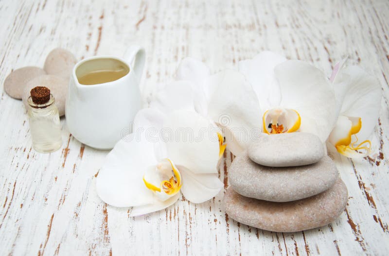 White Orchids with Massage Stones Stock Photo Image of leaf