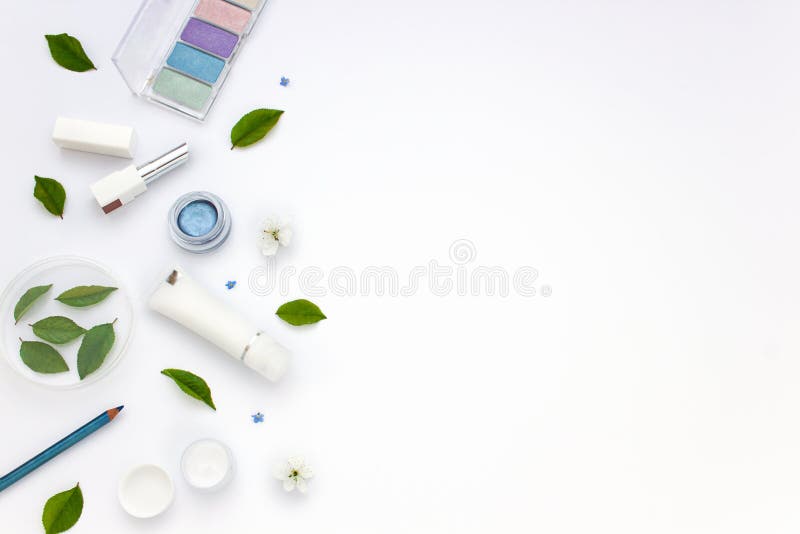 White cosmetics flat lay frame with flowers and leaves. Clean beauty concept royalty free stock photos White cosmetics flat lay frame with flowers and leaves. Clean beauty concept royalty free stock photos