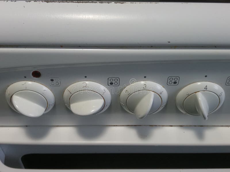 Turning dials on a stove stock image. Image of stove 106363815