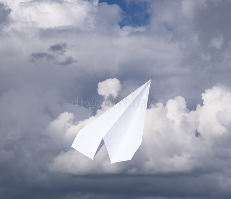 White Paper Airplane in a Blue Sky with Clouds. the Message Symbol in ...