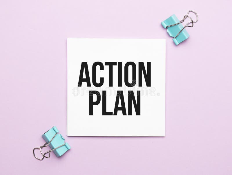 White paper with text ACTION PLAN on a yellow background with stationery royalty free stock images