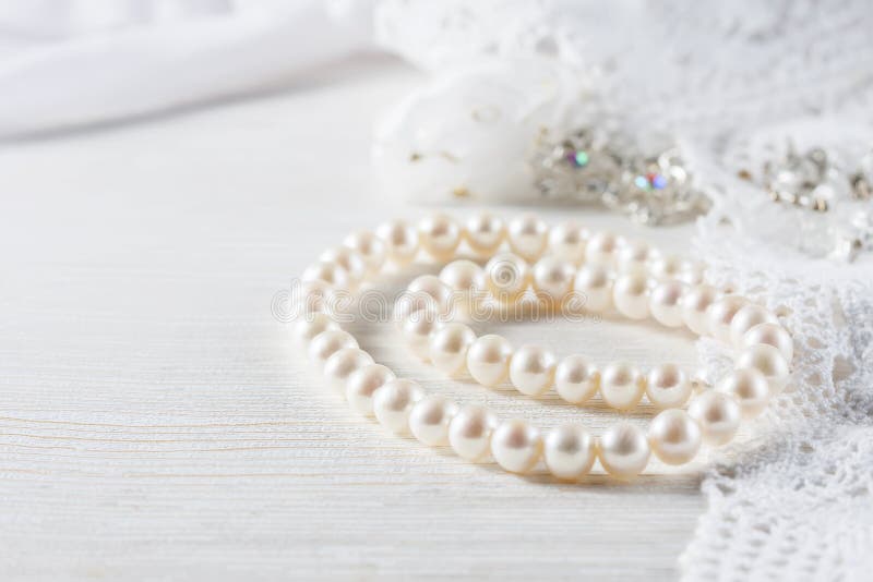 White Pearl Necklace On Handmade Lace Background. Stock Image Image