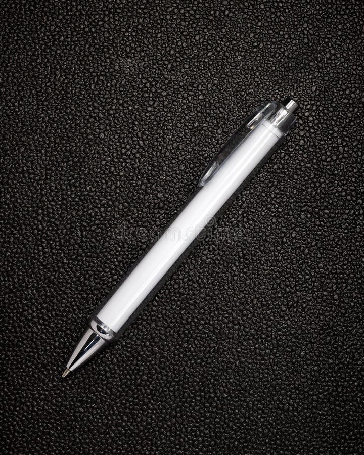 White Pen on Black Leather Background. Template of Ballpoint Pen for