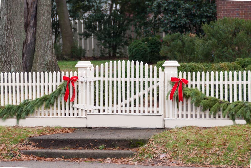 White Picket Fence, Garland, and Red Bow III Stock Photo - Image of ...