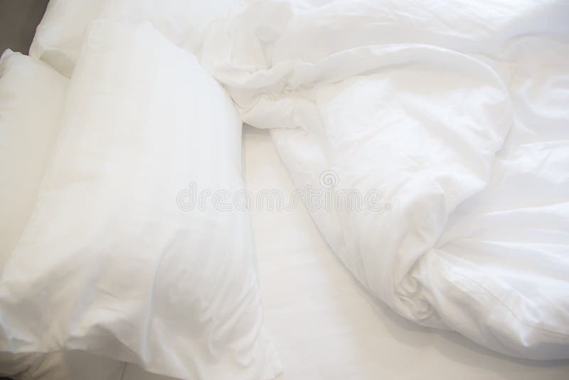 White Pillow on the Bed with Blanket, Bedding Sheet and Shadow Soft