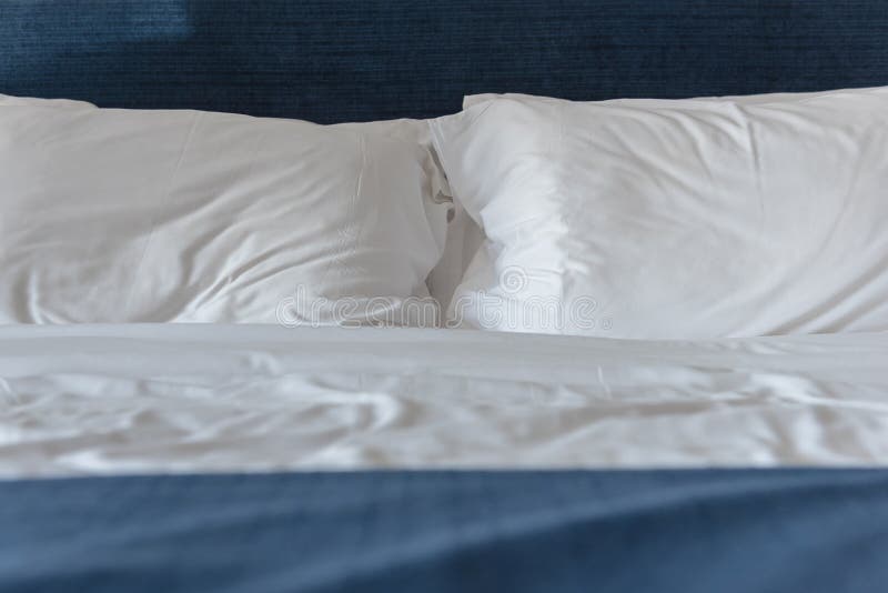 White pillows on bed stock photo. Image of traditional 97257986