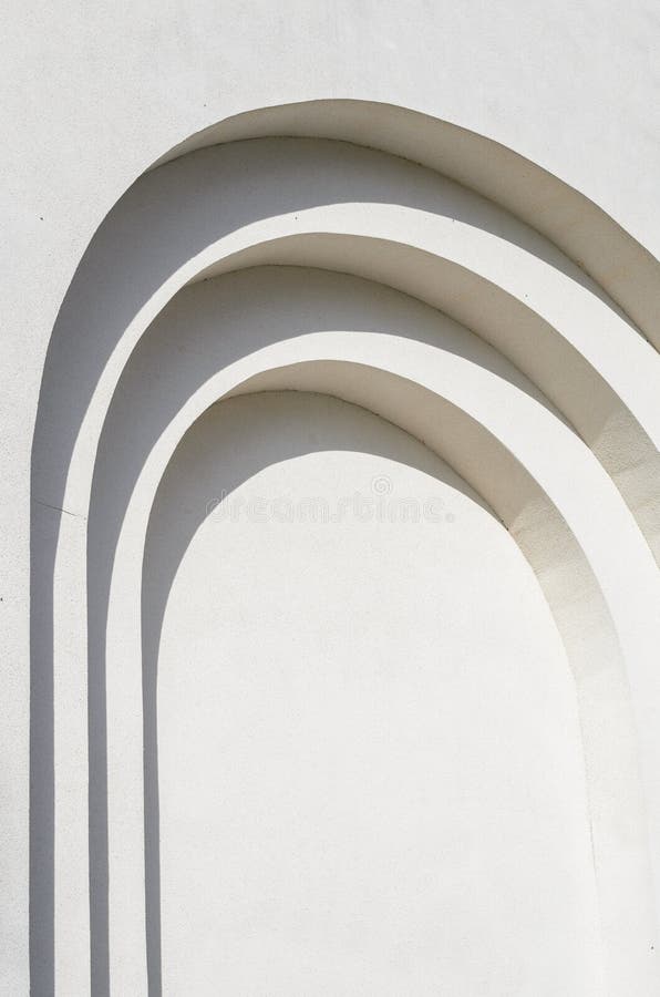 Abstract lines of arches in a white plastered wall. Abstract background with flowing lines. Architecture backdrop. Concrete fragment stock images, royalty-free photos and pictures