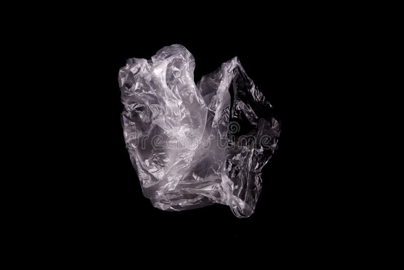 White plastic bag isolated on a black background royalty free stock image