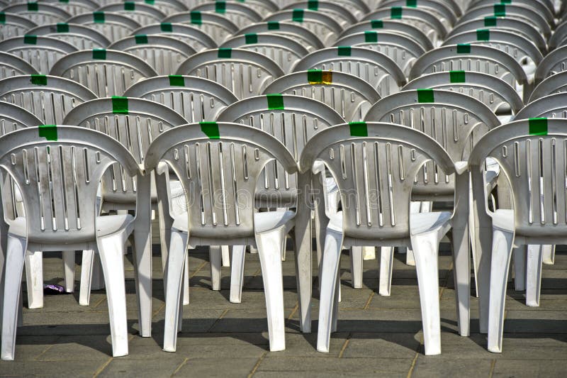 White plastic chairs stock image. Image of chair, uniformly - 82340143
