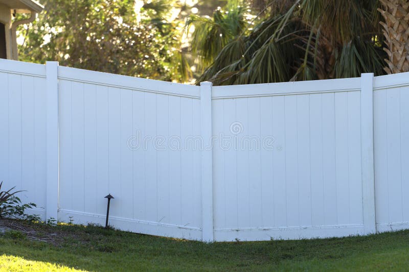 White Plastic Fence for Back Yard Protection and Privacy Stock Image