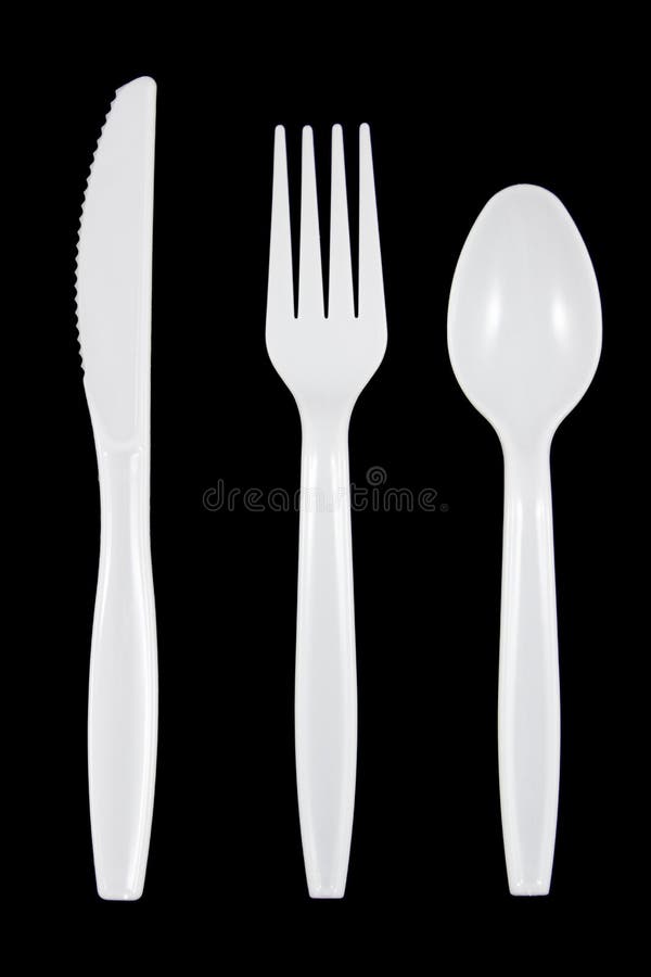 White Plastic Knife, Fork and Spoon on Black Background. Stock Image