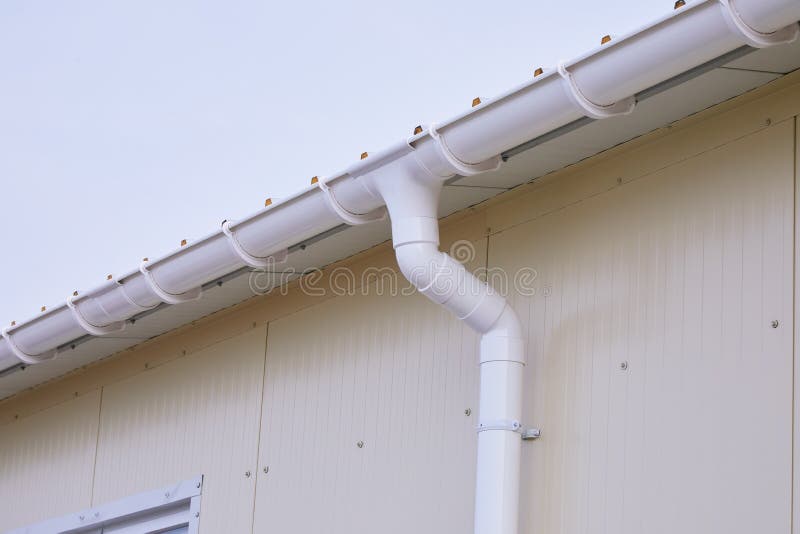 White Plastic Rain Guttering System. Guttering Drainage Pipe Exterior