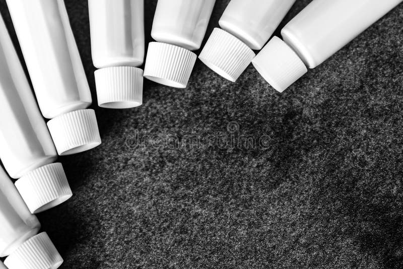 White Plastic Tubes with Dark Background Stock Photo Image of paint