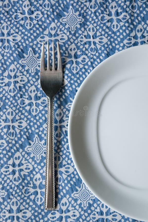 White plate and silver fork