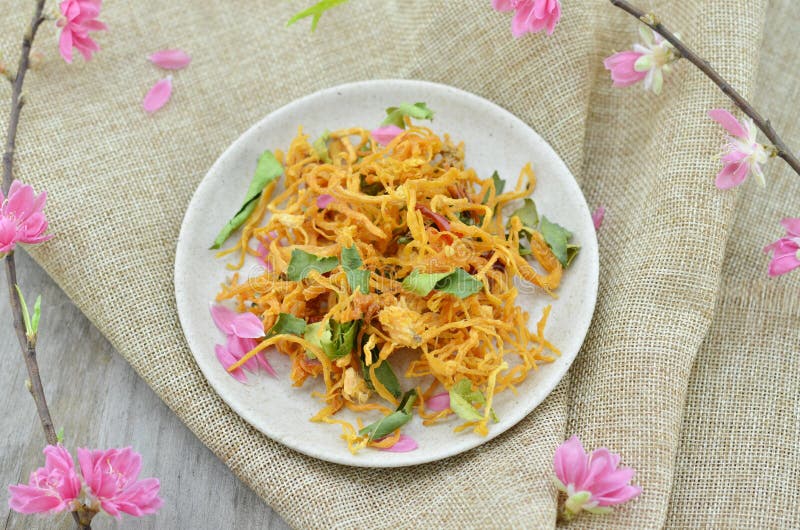 White plate with special dried chicken and peach flower blooming stock photography White plate with special dried chicken and peach flower blooming stock photography