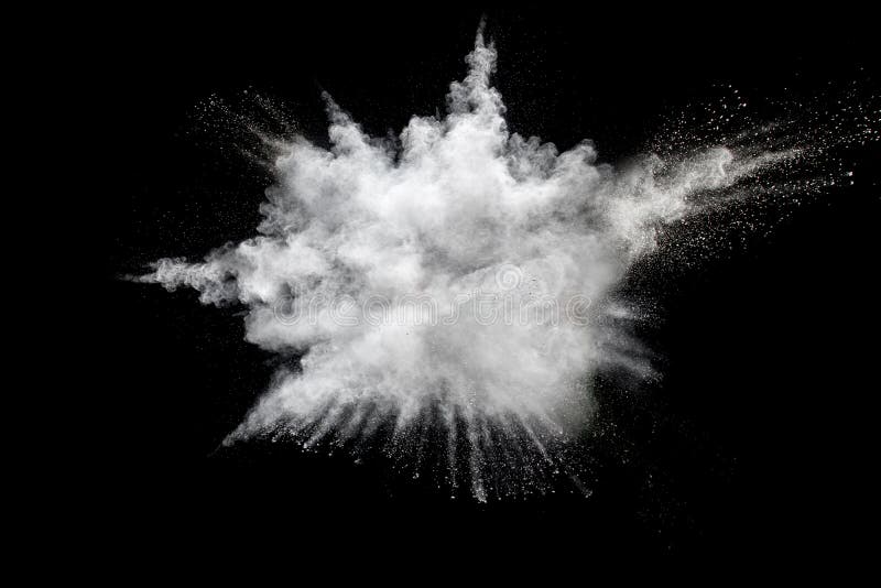 White powder explosion on black background.Stopping the movement of white powder on dark background.