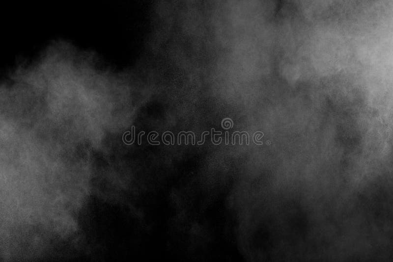 White powder explosion isolated on black background. White dust particles splash.Color Holi Festival