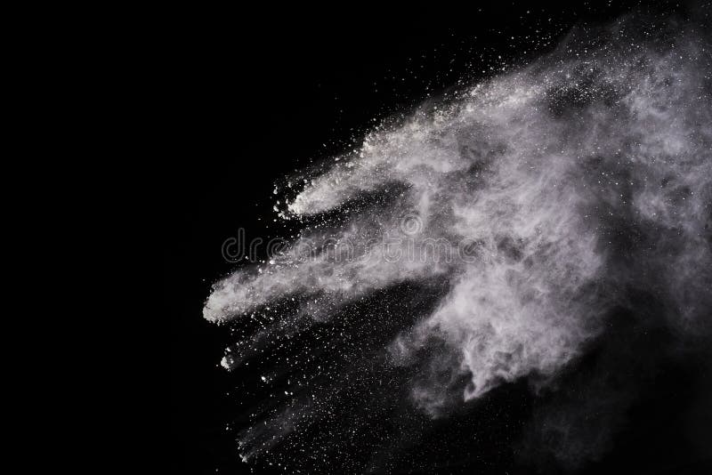 Freeze Motion Of White Color Powder Exploding On Black Background
