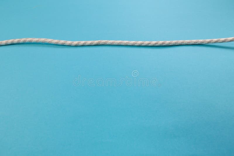 White power cable socket on blue background royalty free stock photography