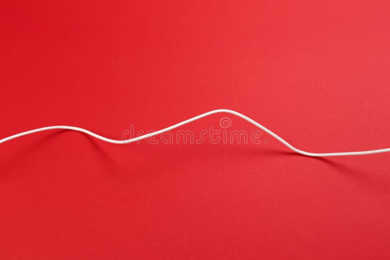 White power cable socket on red background stock image