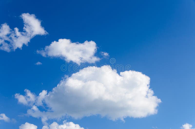 White Puffy Clouds in Blue Sky royalty free stock photo White Puffy Clouds in Blue Sky royalty free stock photo