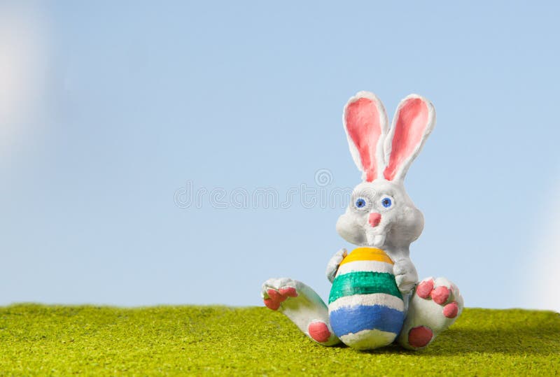 White Rabbit from polymer clay on the lawn with painted egg character Easter Gift Spring hand made no trade mark.