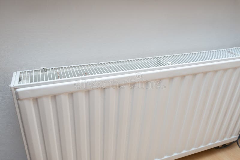 White Radiator of a Central Heating System, Warm and Cozy Home Concept