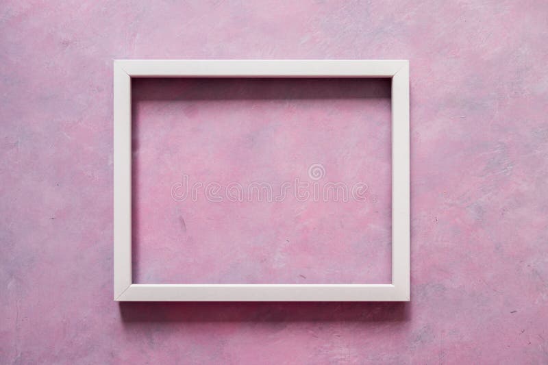White rectangular picture frame mock-up with copy space for yout text or image on top of pink background stock photography White rectangular picture frame mock-up with copy space for yout text or image on top of pink background stock photography