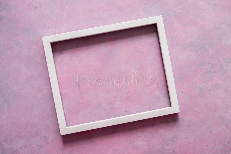 White rectangular picture frame mock-up with copy space for yout text or image on top of pink background stock photography White rectangular picture frame mock-up with copy space for yout text or image on top of pink background stock photography
