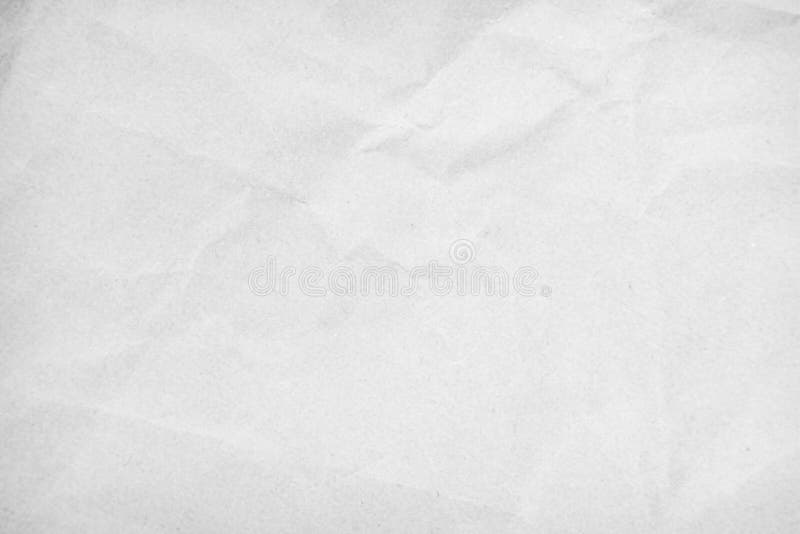 White recycled craft paper texture as background. Grey paper texture, Old vintage page or grunge vignette of old newspaper.