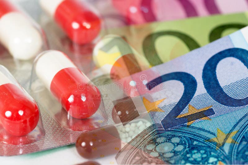 White red antibiotic capsules with euro banknotes, expensive medicines concept