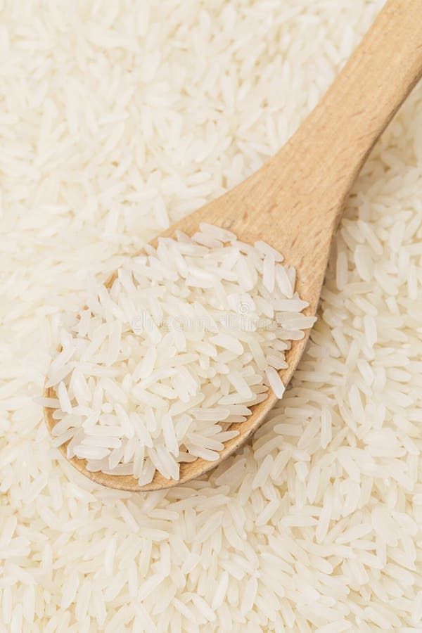 White rice on teaspoon stock image. Image of cuisine 33571227