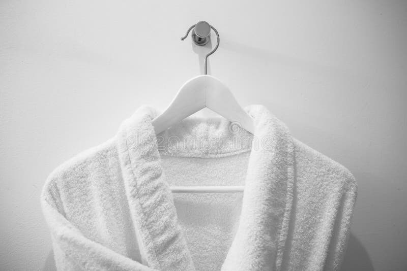 White Robe on the Hanger in the Bathroom. Stock Photo Image of