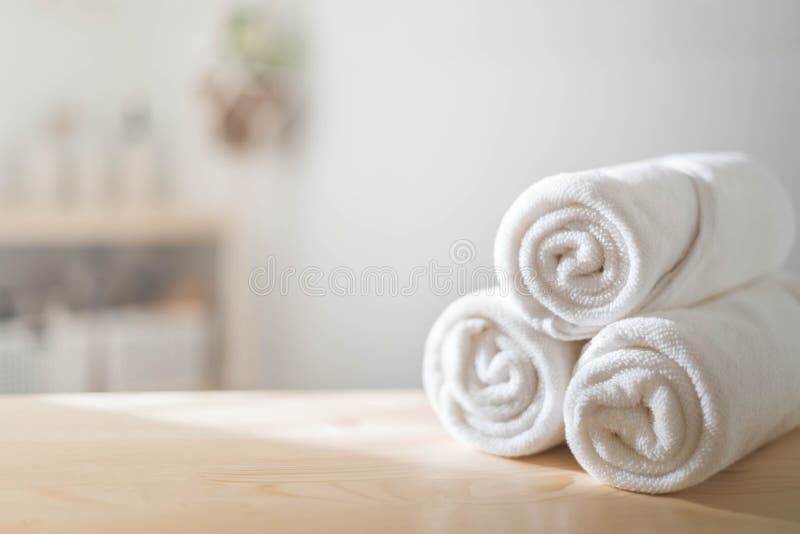 https://thumbs.dreamstime.com/b/white-rolled-towels-wooden-countertop-spa-beauty-body-care-hygiene-procedure-bathroom-blurred-background-bath-textile-fabric-263770707.jpg