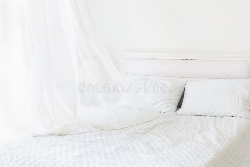 White Room Minimal Interior Design. White Bed in White Room Stock Image