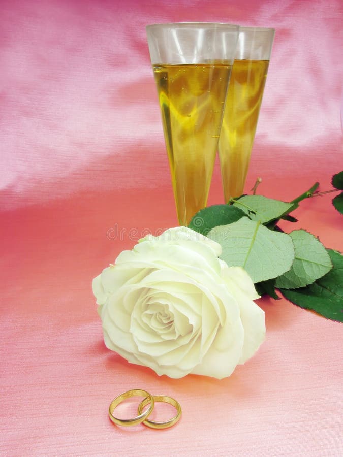 White rose and wedding rings